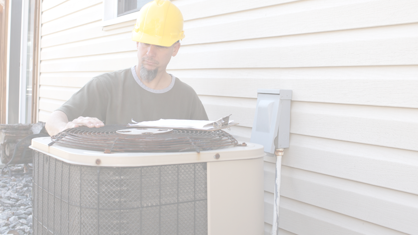 A licensed HVAC Technician performs AC repair on a condenser outside a home