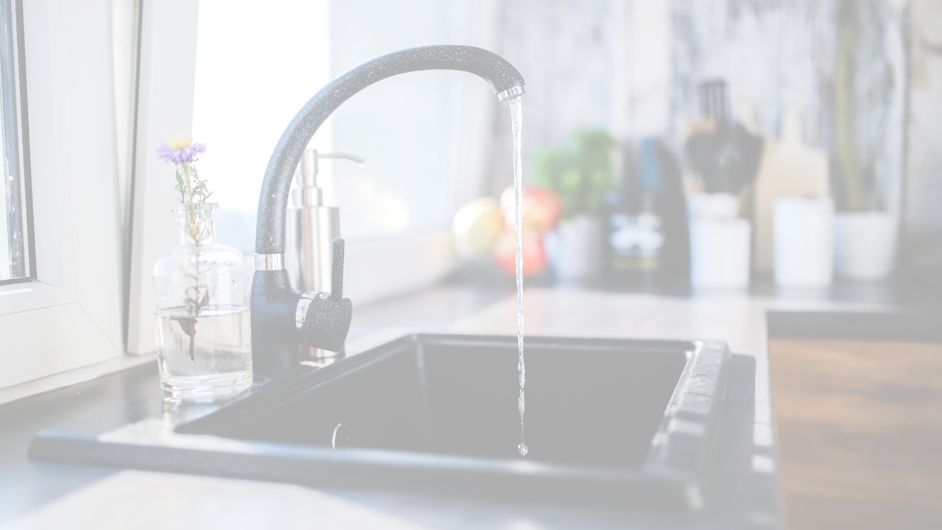 A kitchen sink with water flowing thanks to indoor plumbing in Port Charlotte, Florida
